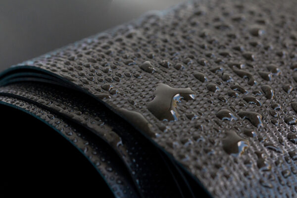 Water droplets on the rubber membrane. Waterproofing...  Close-u
